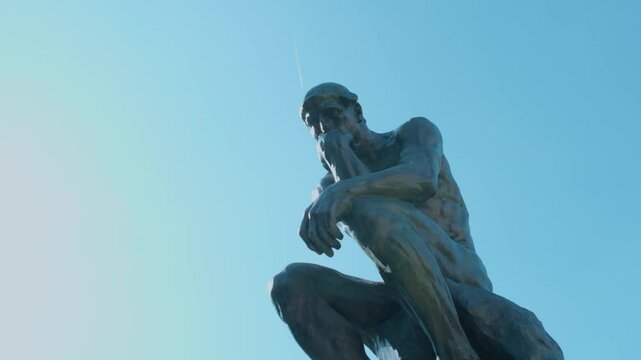 Auguste Rodin's The Thinker with a blue sky in Paris