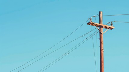 Isolated high voltage pole on blue background with space for text