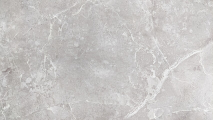 A close-up photo of a grey marble slab with white veins, ideal for backgrounds and textures