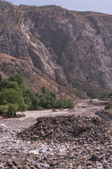 A mountain range with a rocky, barren valley in between