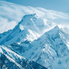 The breathtaking snowy mountain peaks of the serene alpine wilderness on a sunny winter day