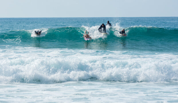 professional surfer riding waves, men catching waves in ocean, isolated. Surfing action water board sport. people water sport lessons and beach swimming activity on summer vacation