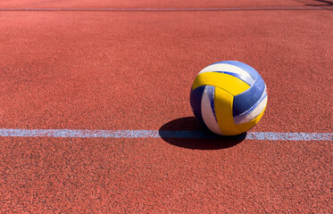 Volleyball ball on an outdoor court.