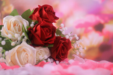 bouquet of roses on blurred pink background
