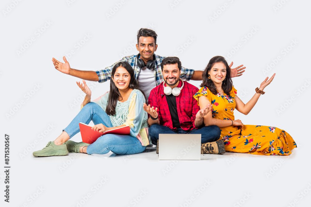 Wall mural Indian asian college students using laptop isolated against white background