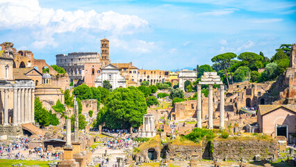 The Roman Forum shows ancient ruins, with the Colosseum in the background. Tourists explore the...