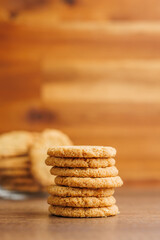 Tasty oatmeal cookies  on wooden table.