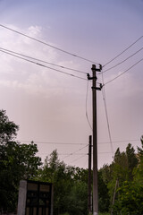 Obraz premium A power line pole with three wires hanging from it