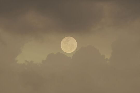 Full moon with clouds in the sky.