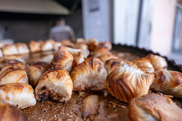 A tray of pastries with a burnt crust