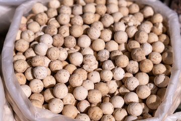 A bag of white balls is shown