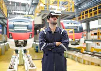 Engineer or technician wearing virtual reality glasses(VR) at train station construction site