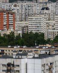 Modern multi-storey residential building is modern. Panel brick high-rise building in a green area of the old town. Top view on a sunny day. concept of real estate rental construction. Housing stock