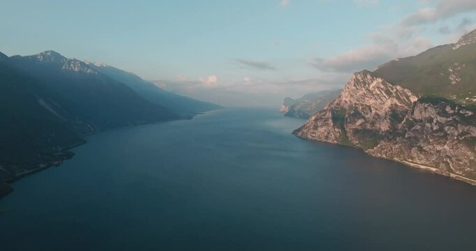 Aerial view of the landscape of Lake Garda in the Dolomite Alps of Italy. Landscape nature mountain ranges rocky peaks on the shore of a tourist lake, travel and incredible beauty of nature.