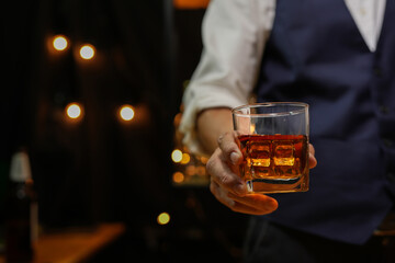 Bartender pouring Whiskey, on  bar