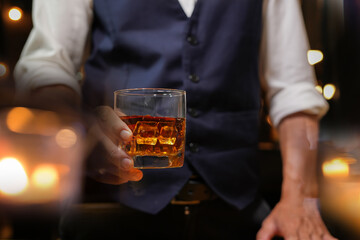 Bartender pouring Whiskey, on  bar
