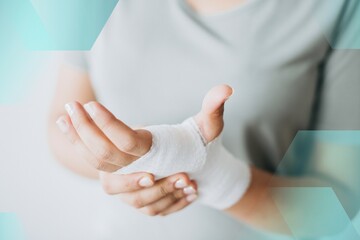 Woman with gauze bandage wrapped around her hand