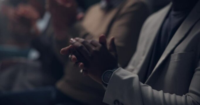 Applause, support and hands of business people at seminar for achievement, announcement or promotion. Team building, men and women celebrate company growth in dark conference room with solidarity.