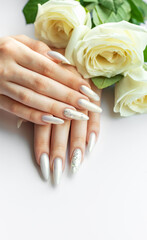 Fototapeta premium Female Hands with beautiful pearl manicure