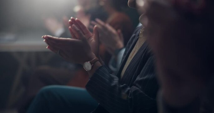 Applause, success and hands of business people at convention for achievement, announcement or promotion. Team building, men and women celebrate company growth in dark conference room with solidarity.