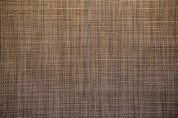 A beautifully crafted weaving pattern showcases its intricate and geometric design, blending traditional craftsmanship with modern aesthetics. The interlaced threads form a symmetrical and detailed