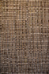 A beautifully crafted weaving pattern showcases its intricate and geometric design, blending traditional craftsmanship with modern aesthetics. The interlaced threads form a symmetrical and detailed