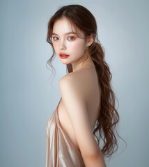 Naklejka premium Beautiful young woman with smooth, flawless skin A glowing face and body Fashion styles are ideal for advertising cosmetics and skincare products. It captures the beauty and elegance of nature.