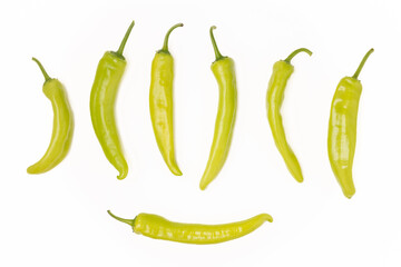 Green hot fresh chili peppers on a white background