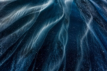 abstract blue waves with dynamic fluid patterns and light reflections, dark blue tone background.