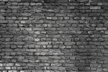 Fototapeta premium gray wall made of old brick close-up