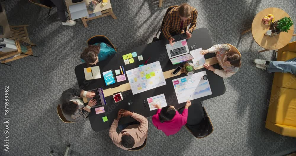 Poster top down view: diverse team of entrepreneurs working on digital marketing strategy. businesspeople a