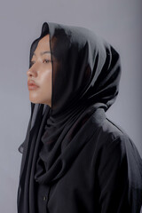 Asian Hijab Woman Wearing Black Dress