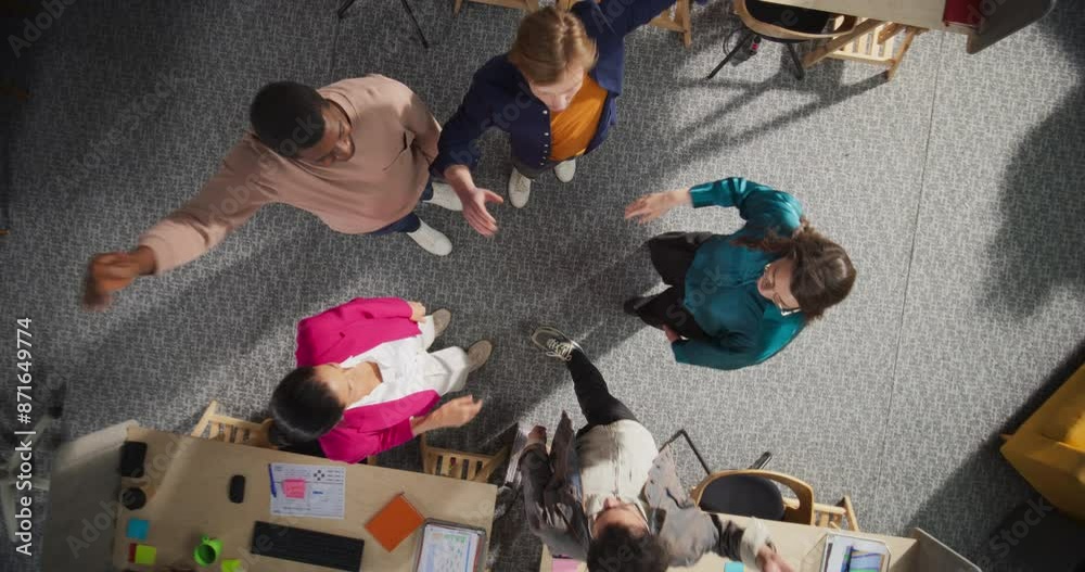 Aufkleber Top Down View of Diverse Team Stacking Hands in an Office, Symbolizing Unity and Teamwork. Professional Managers And Specialists Celebrating A Successful Month Of Sales And Revenue Growth. Slow Motion