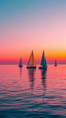 Fototapeta premium Calm sea and pink gradient sky with sailboats on the horizon. Beautiful seascape with sailboats during sunrise or sunset.