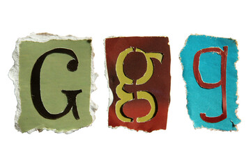 G alphabet torn from a magazine paper. Ransom note style letters.