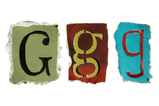 G alphabet torn from a magazine paper. Ransom note style letters.