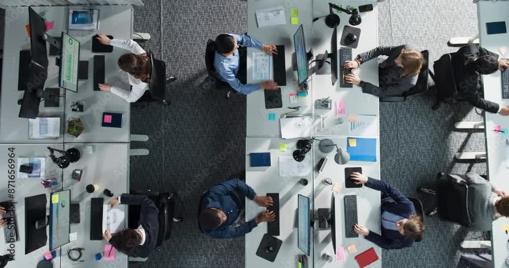 Fototapete Top Down View of Multiethnic Team in a Corporate Office, Working on Desktop Computers And With Financial Documents. Colleagues Working Creating Reports, Developing Business Strategies For Hedge Fund.