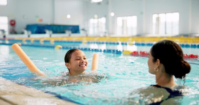 Mother, girl and happy in swimming pool for lesson in centre for fun, bonding and recreation with child development. Parent, kid and smile or excited for sport, support and care with training