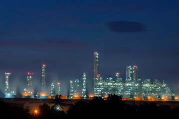 Gas turbine electrical power plant at dusk with orange sky