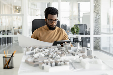 African american architect working in his office and looking busy