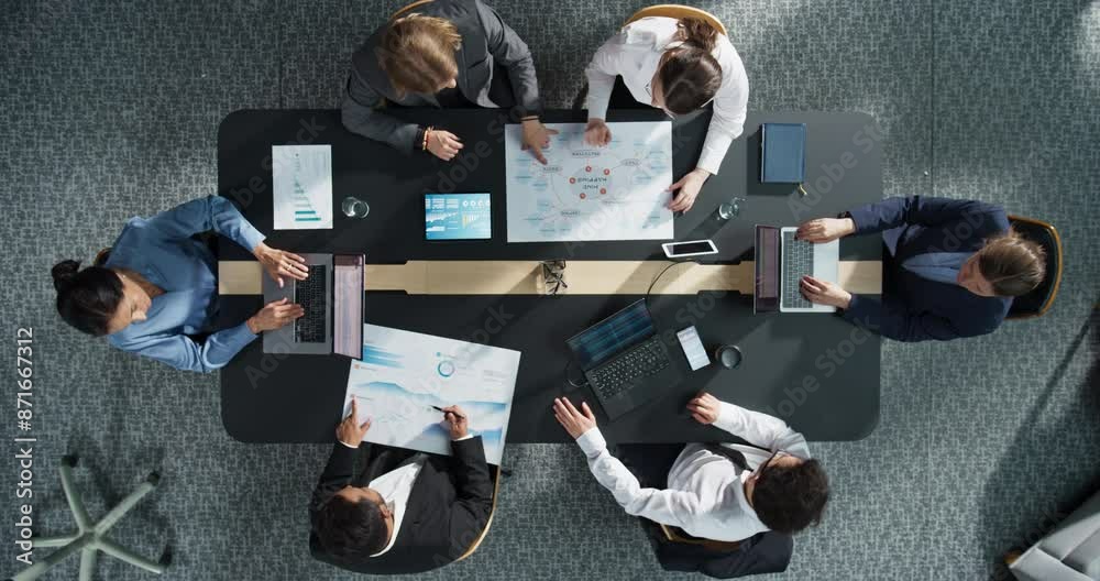 Fototapete top down view, zoom out: diverse professionals working on business statistics reports and digital pl