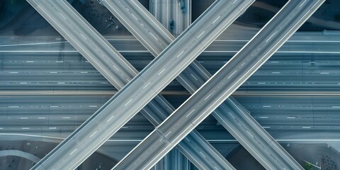 Obraz premium Drone captures traffic flow on busy highway with multiple interchanges and lanes. Concept Drone Footage, Traffic Flow, Highway Interchanges, Multiple Lanes, Busy Highway