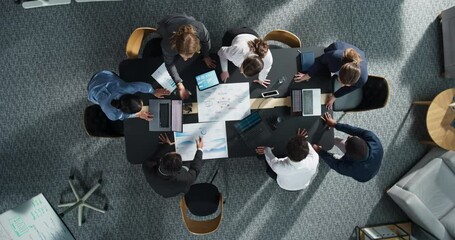 Zoom Out Top Down View: Diverse Team Of Business Professionals With Laptops Entering The Conference Room And Sitting Behind Table To Discuss Financial Data And Project Mindmap in Corporate Office. - Powered by Adobe