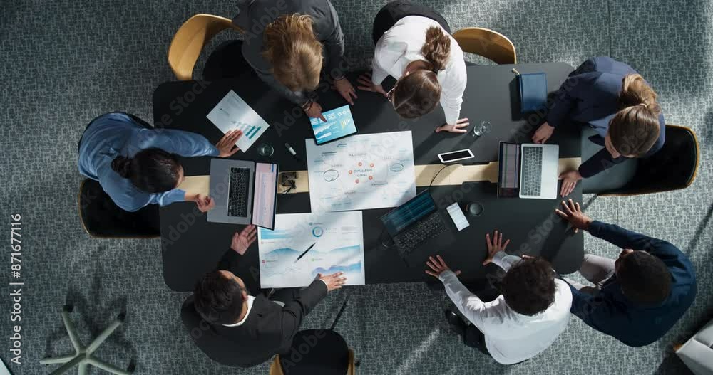 Aufkleber Top Down View Of Diverse Team Of Business Professionals And Managers With Laptops Entering The Conference Room And Sitting Behind Table To Discuss Financial Data And Sales Reports In Corporate Office.