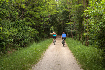 Obraz premium Two road cyclists, male and female on the road