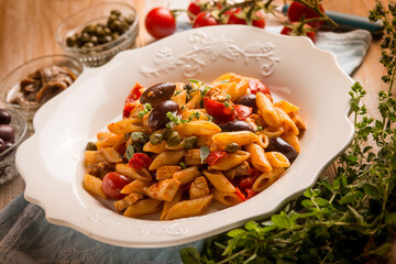 pasta with sword fish tomato black olives and capers