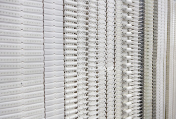 Plastic belt conveyor for food industry production line.