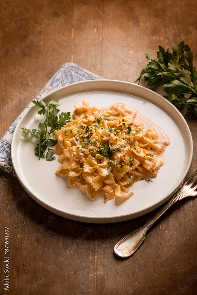 Poster butterfly pasta with smoked salmon cream sauce and parsley