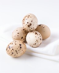 Obraz premium quail eggs lie on a white napkin and on a white background