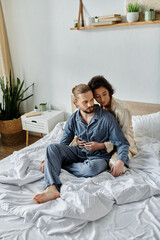 A loving couple relaxes on their bed in their home, enjoying a peaceful moment together.